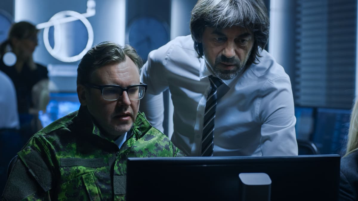 homeland security officials working in a system control room