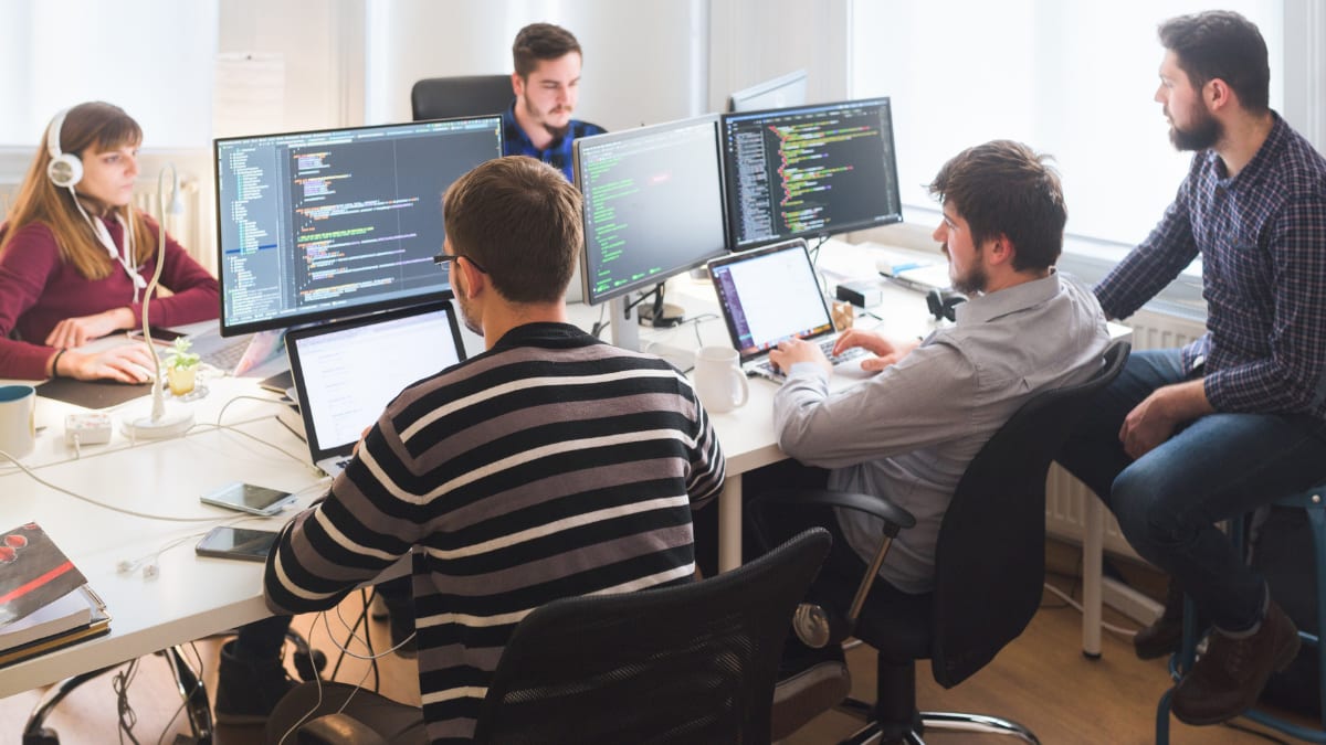 team of software developers working in a computer lab