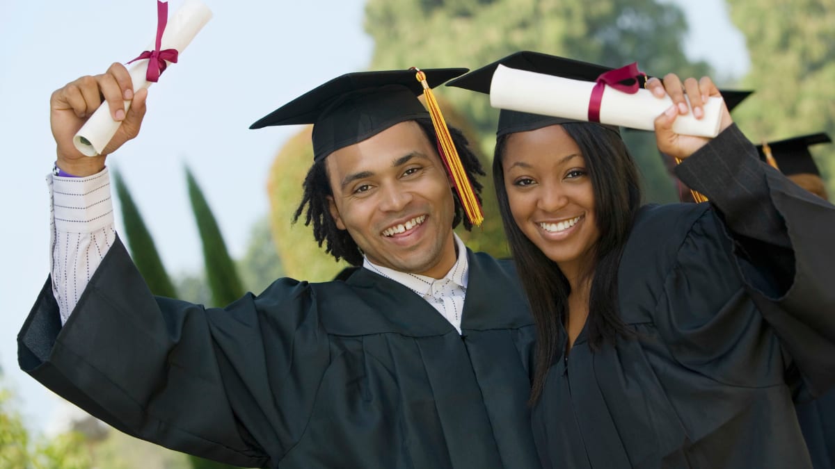 two students graduating from an HBCU school