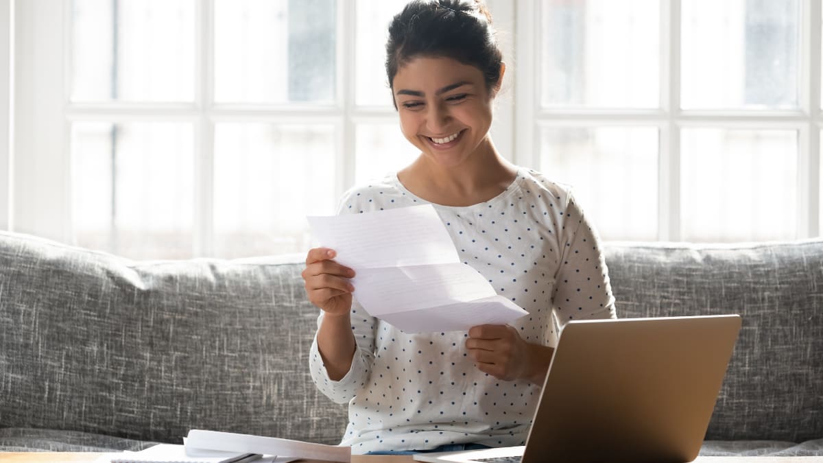 happy future college student receiving a college acceptance letter
