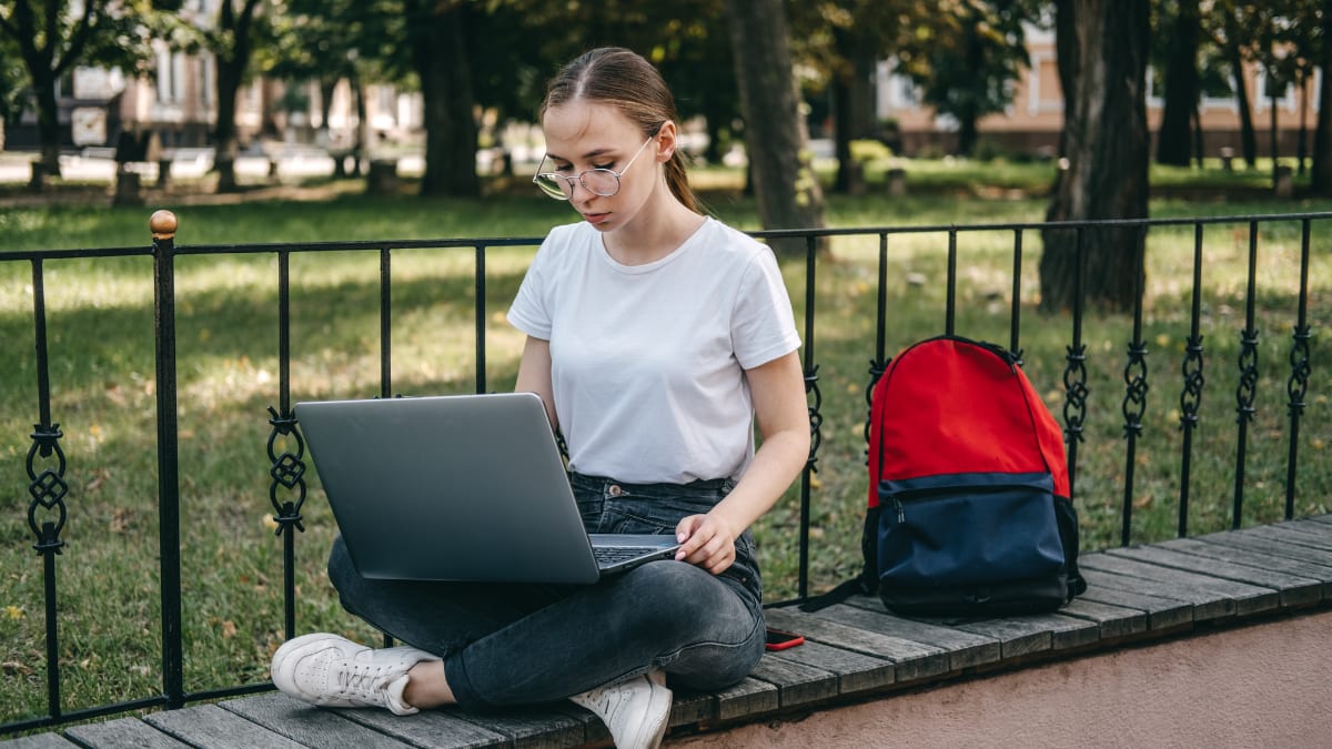 online community college student working on school work outside