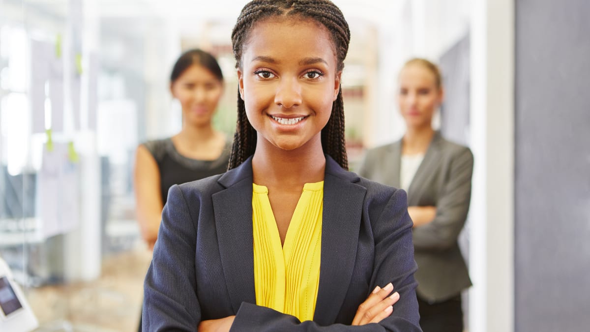 young business student standing in an office setting