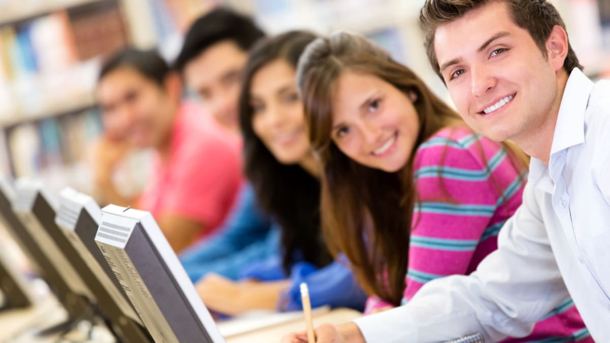 college students working on computers in a lab setting