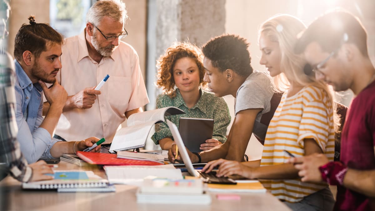 college students working with a professor