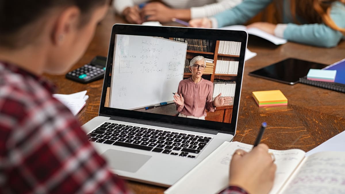 online college student watching a live online lecture