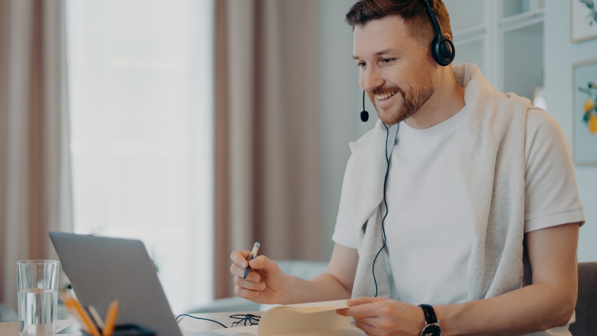 online college student meeting virtually with his college professor