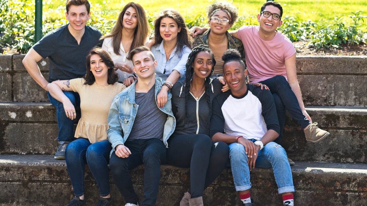college students sitting outside together