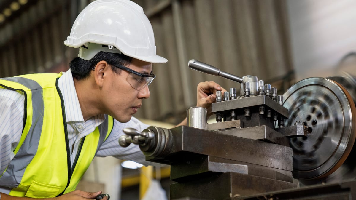 mechanical engineer operating a lathe