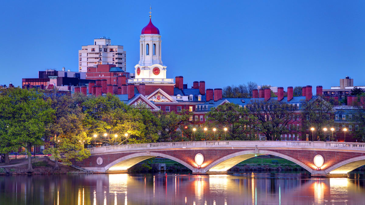 Harvard University across the Charles River at dusk