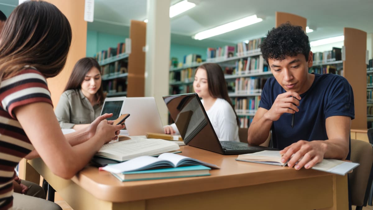 college students studying in a library