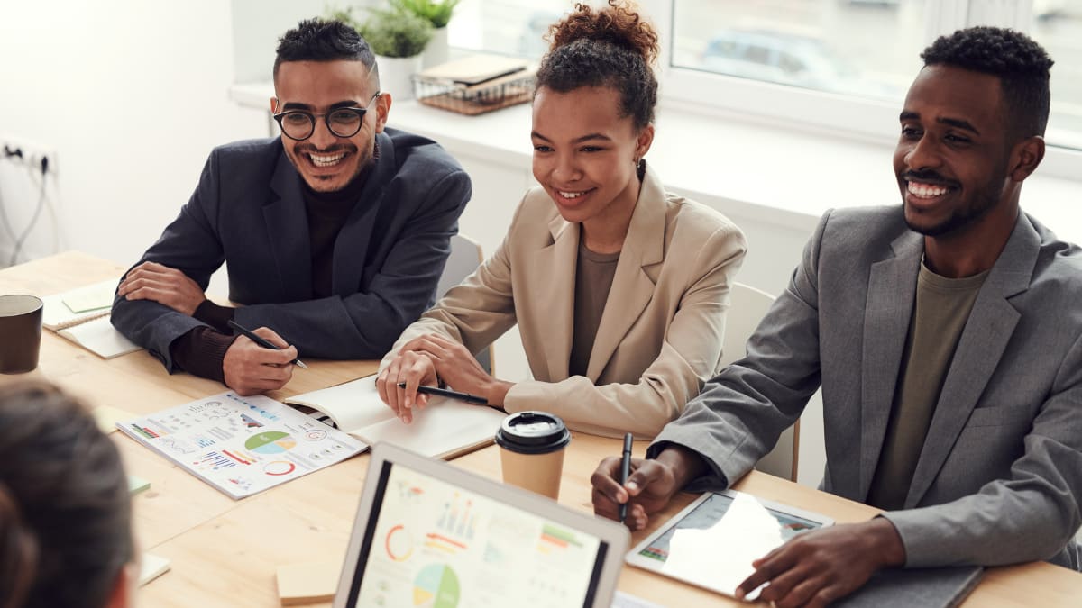 team of business professionals sitting in on a meeting