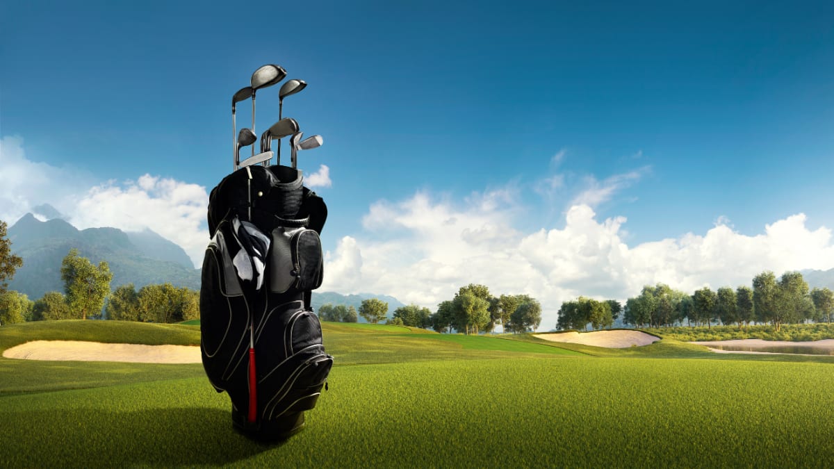 golf bag sitting on a golf course
