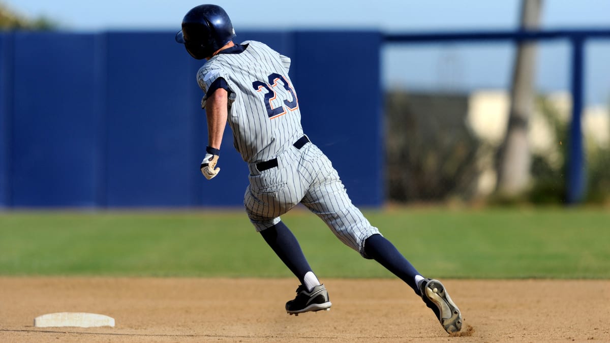 baseball player running around the bases