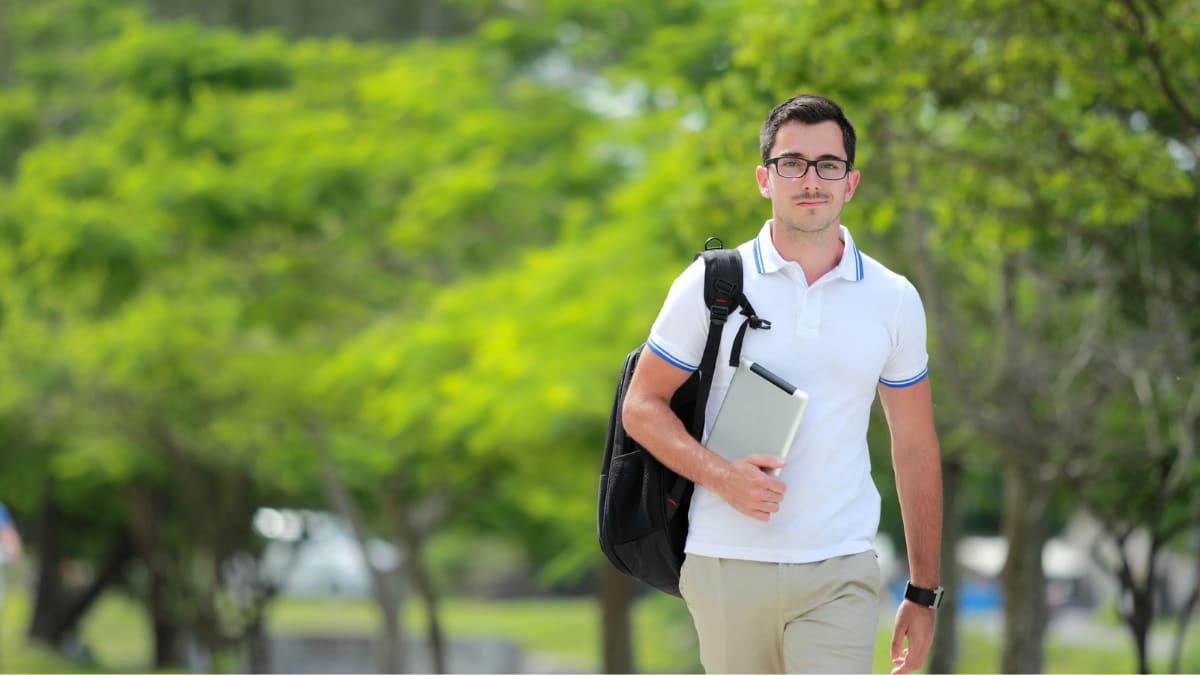 graduate student walking on campus