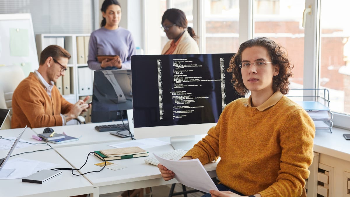 a team of cyber security professionals working in an office
