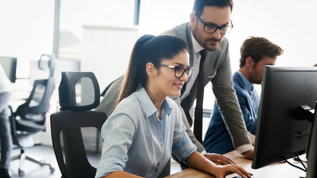 an online cyber security student working in a computer lab
