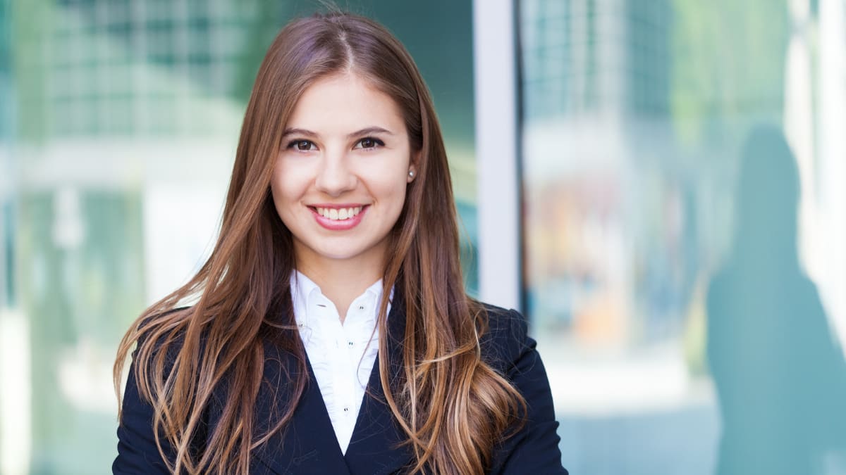 young business professional standing in an office