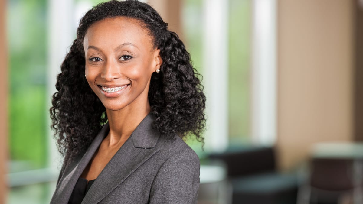 young business professional standing in an office