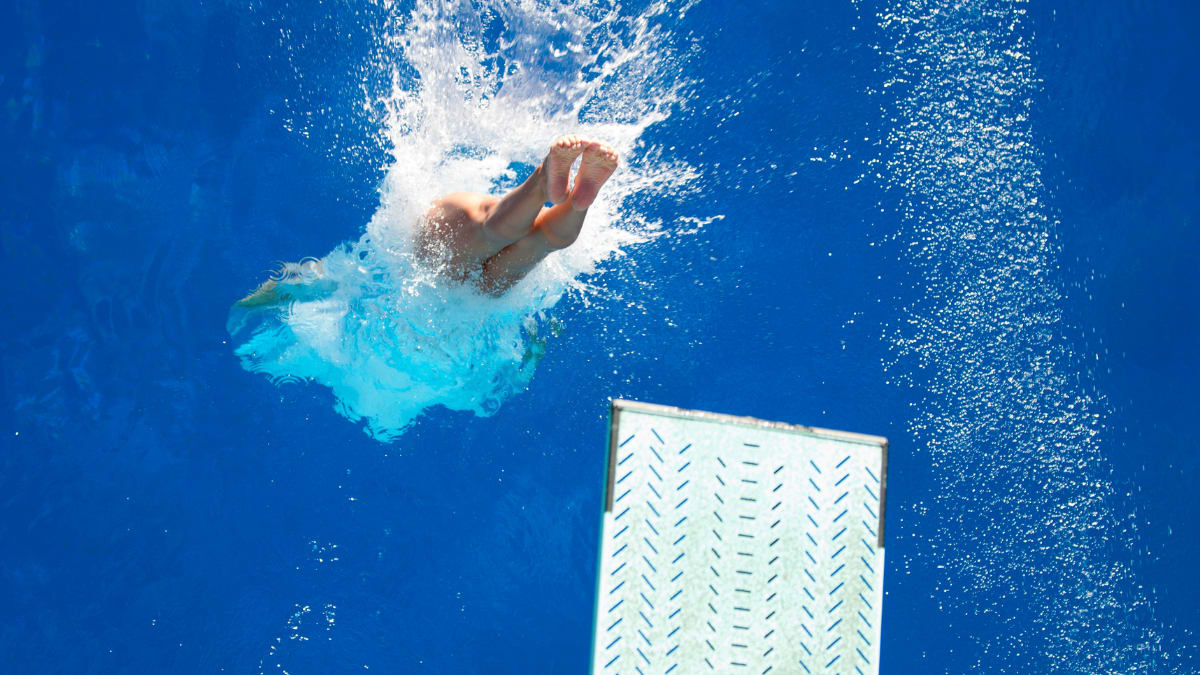 diver diving into the water