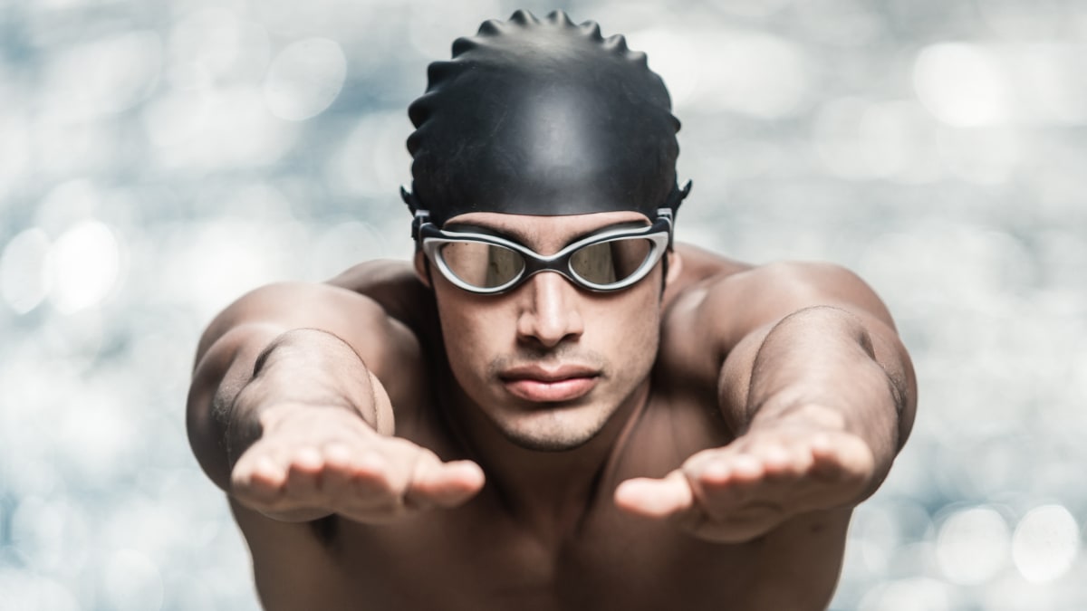 swimmer getting ready to dive into the water