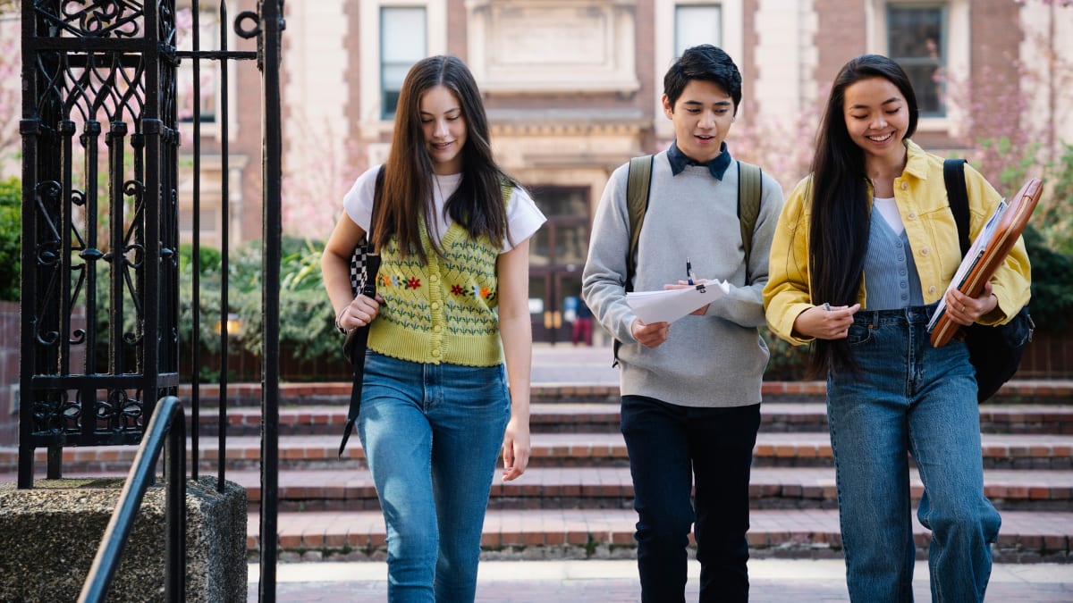 students walking on a college campus