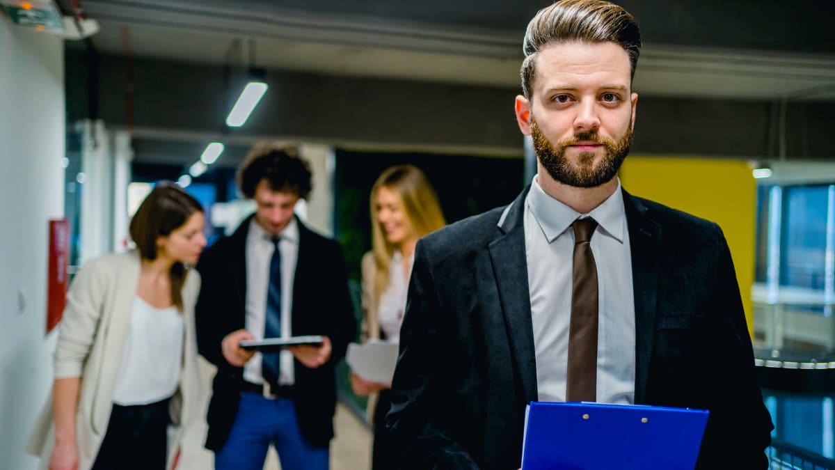 young business professional standing in an office building