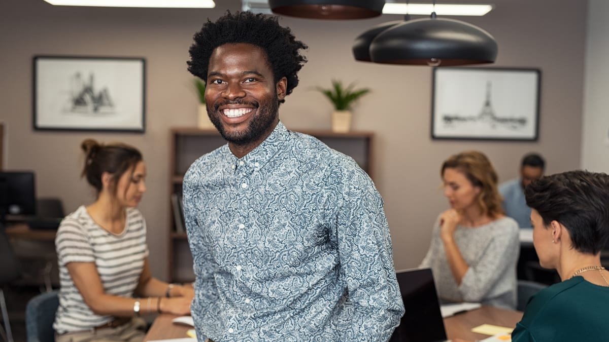 young business professional standing in an office