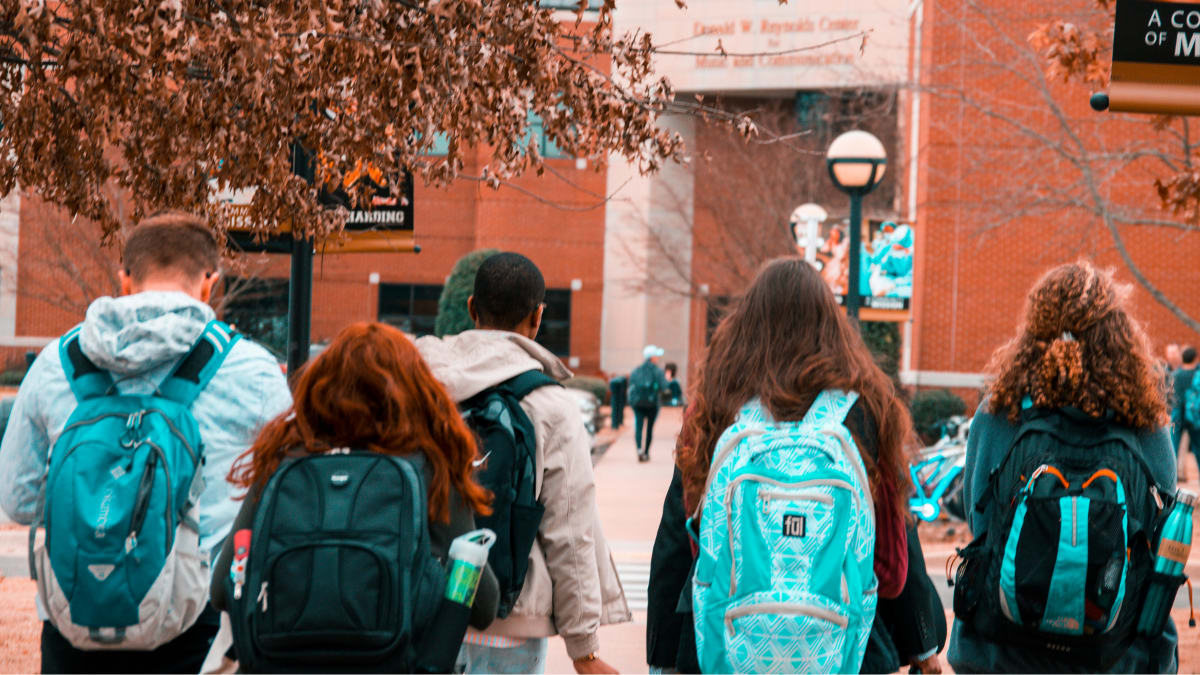 students walking on a college campus
