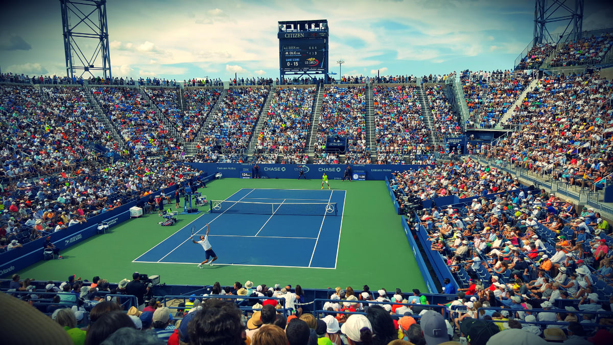 tennis match with numerous spectators