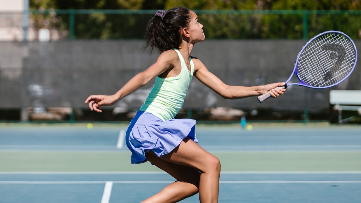 tennis player hitting a tennis ball