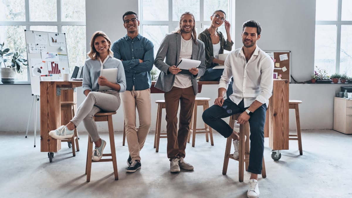 a team of young business professionals sitting in an office