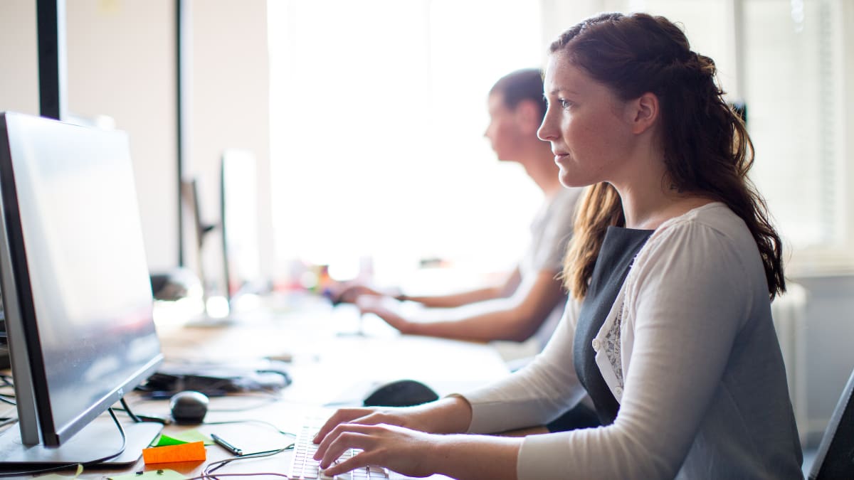 cyber security student working in a computer lab