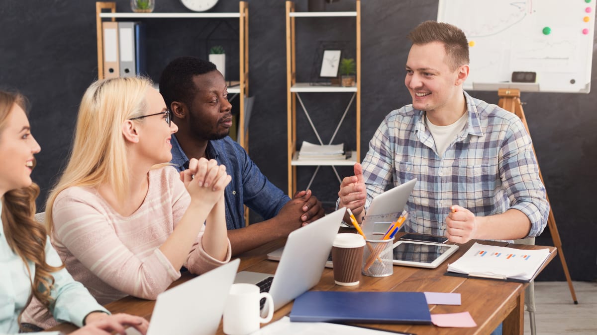 team of software programmers meeting together