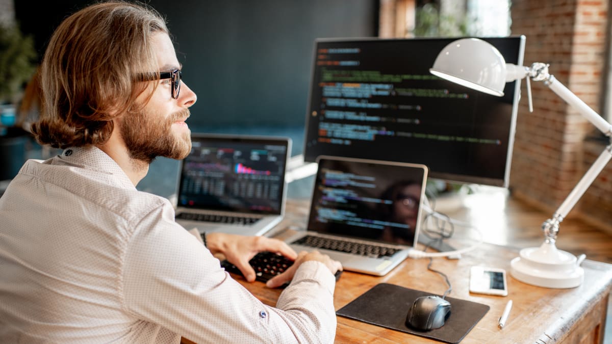 cyber security expert sitting at a desk in an office
