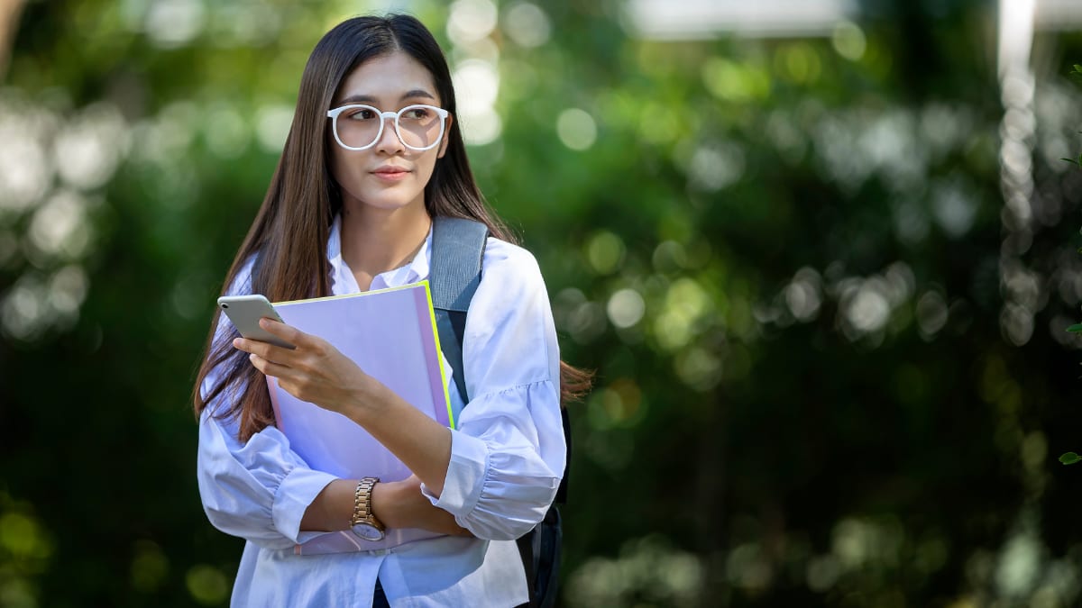 college student standing outside on a college campus