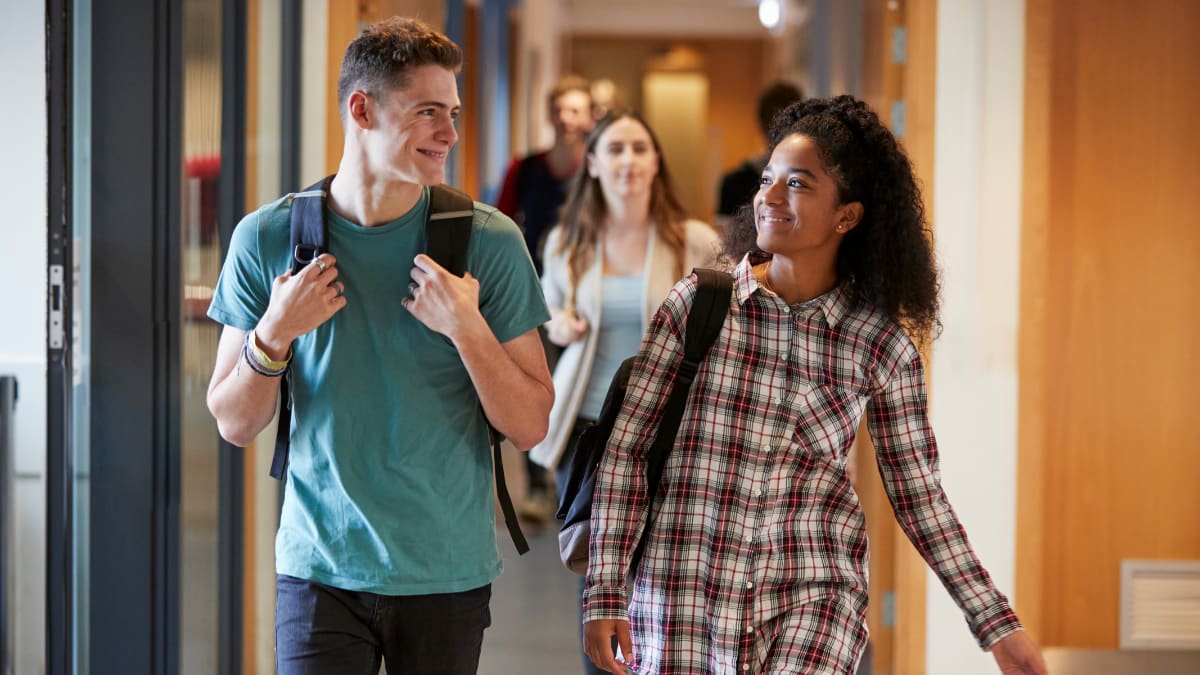 two college students walking together