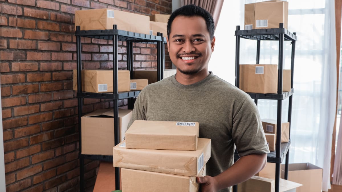 young entrepreneur holding packages
