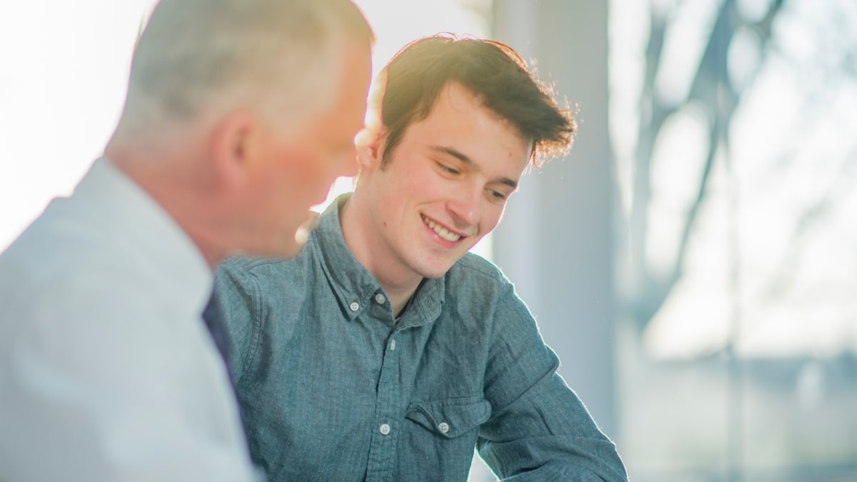 college student meeting with his mentor