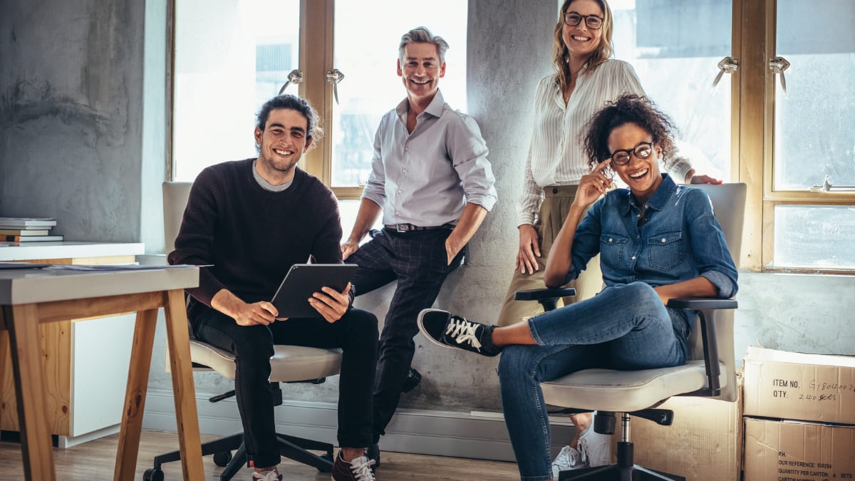 a graduate student meets with a team of business professionals