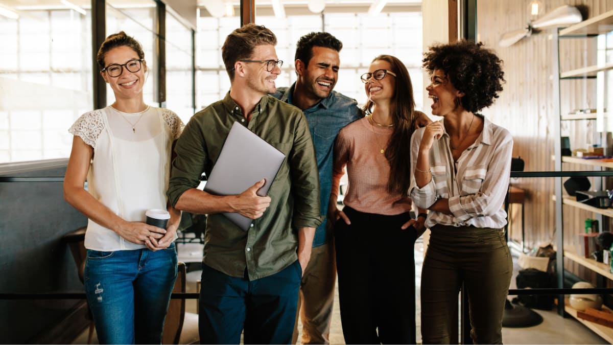 team of young business professionals walking together in an office