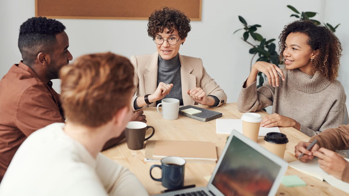 graduate student interns sitting in a meeting