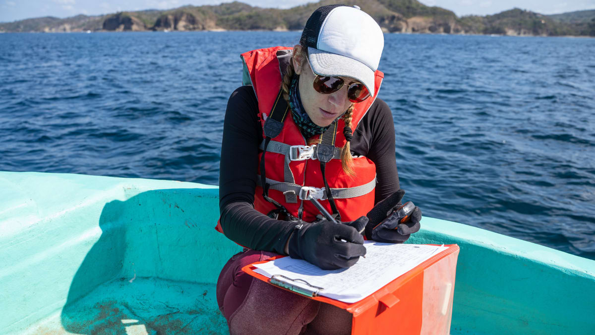 oceanographer recording data