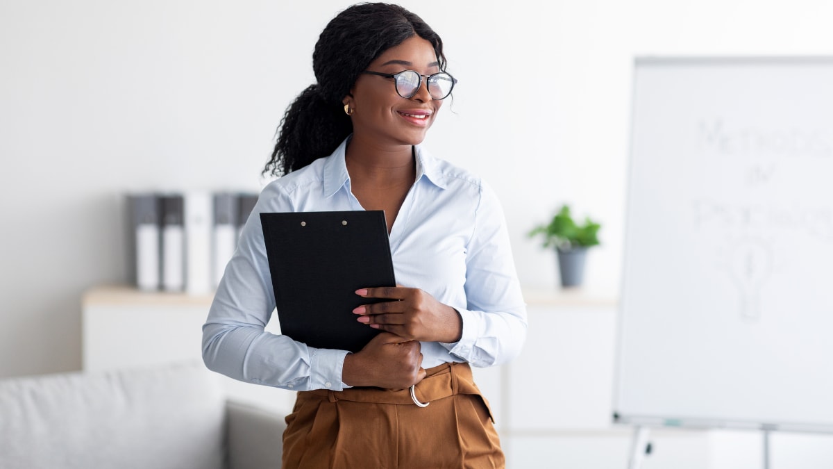 young business professional standing in an office