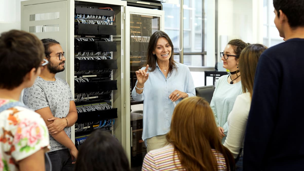 professor with students in a computer lab