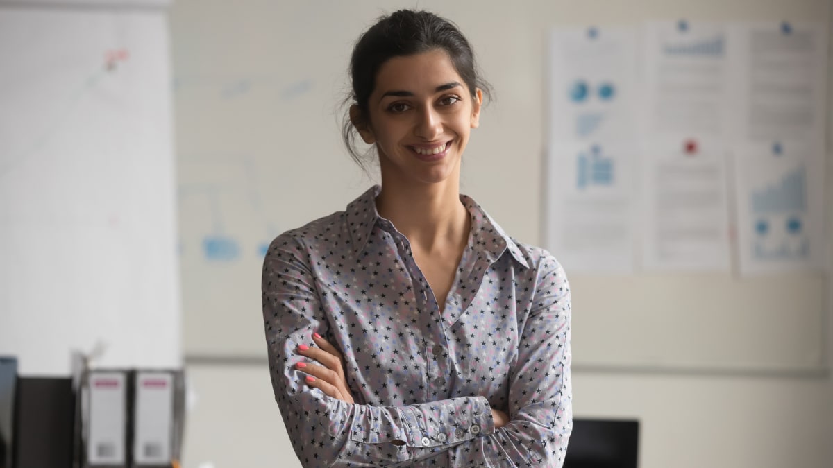 young business professional standing in an office