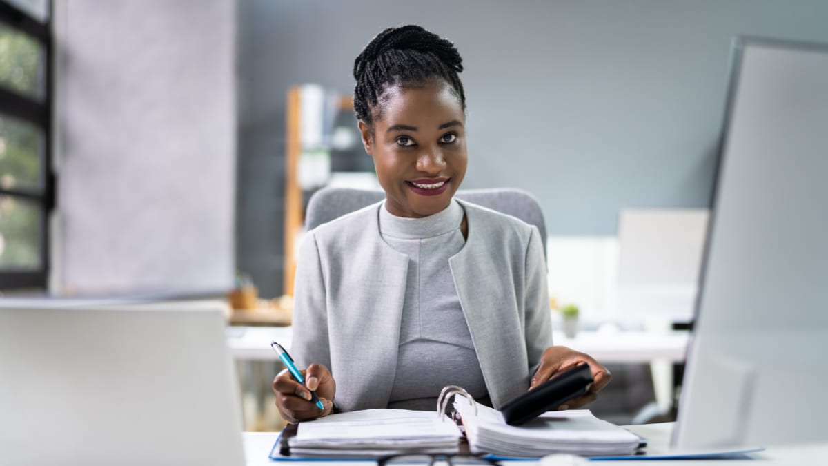 young business professional sitting at a desk