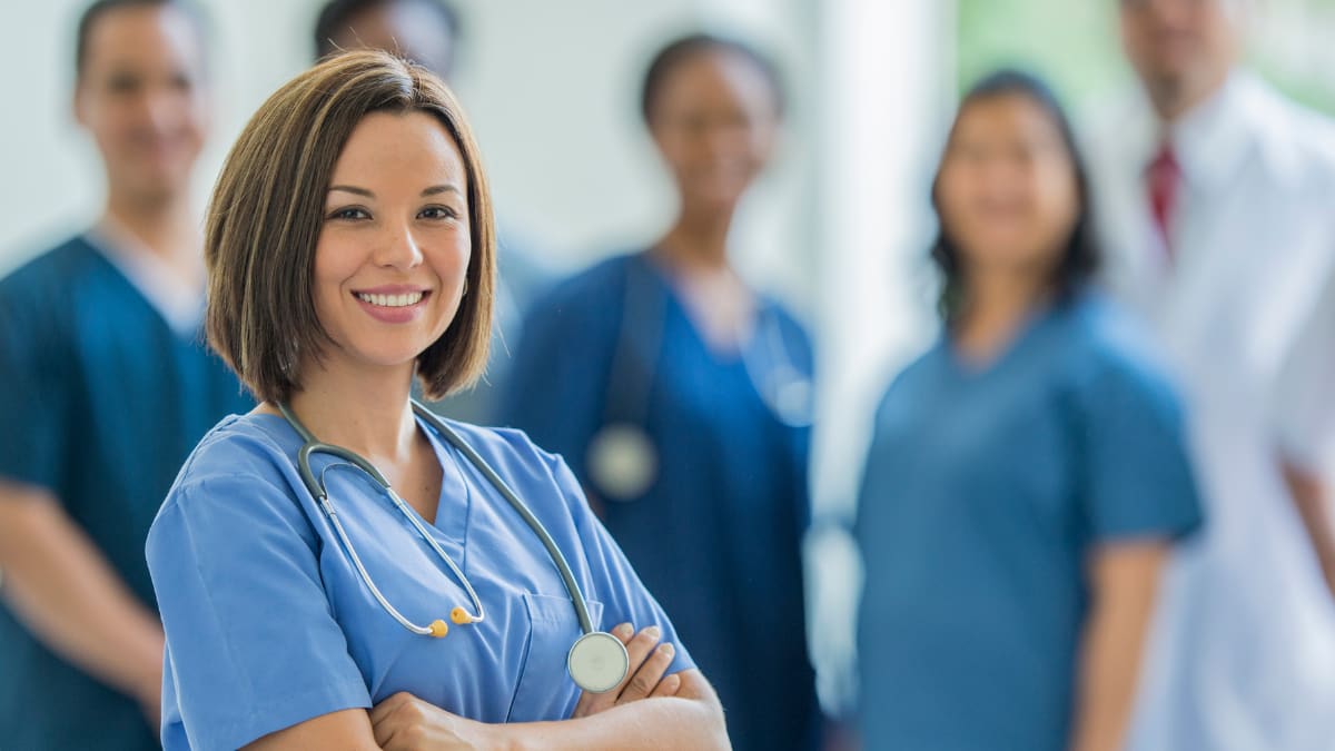 nurse standing with a team of nurses