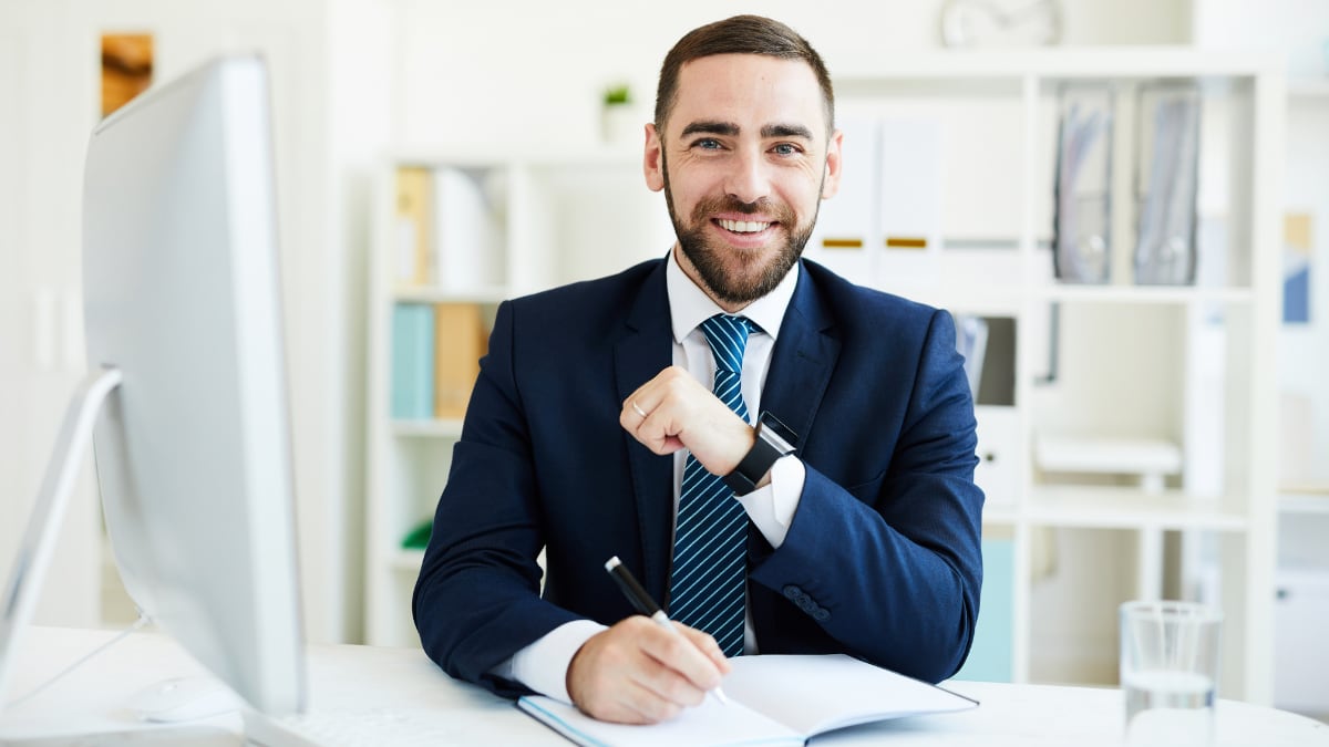 young business professional sitting at a desk