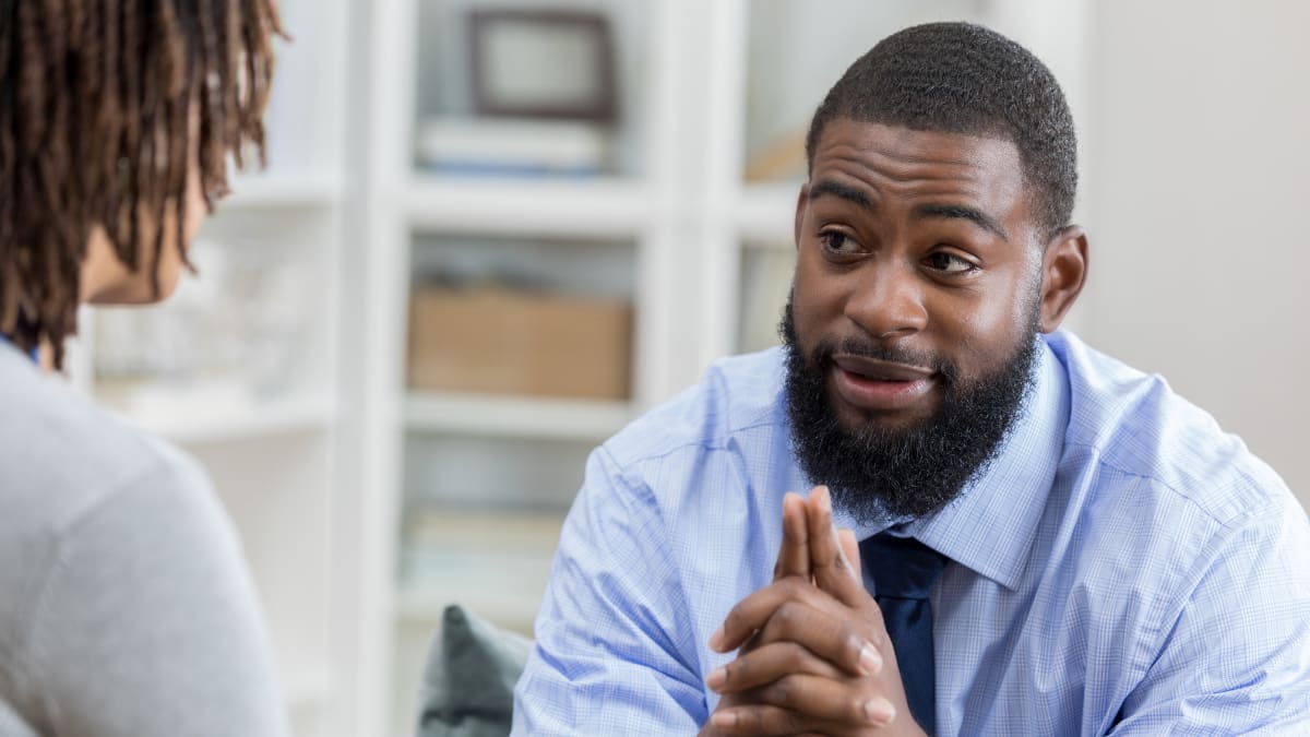 psychologist sitting with a client