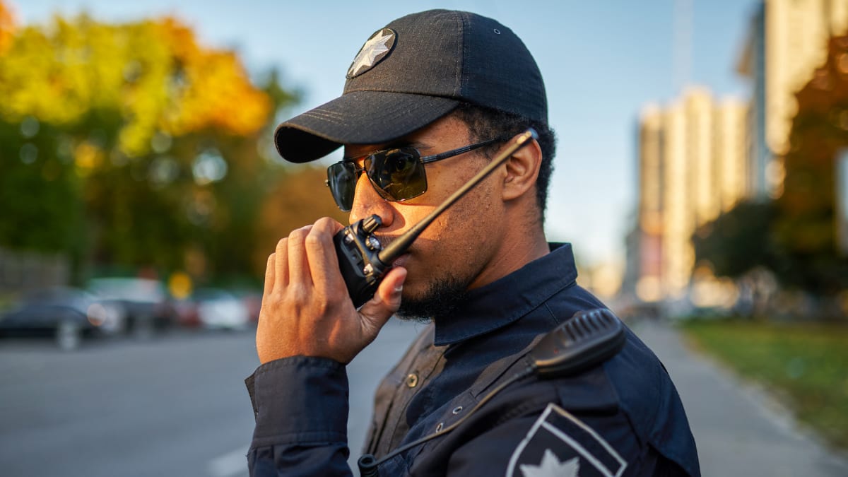 police officer talking on a walkie talkie